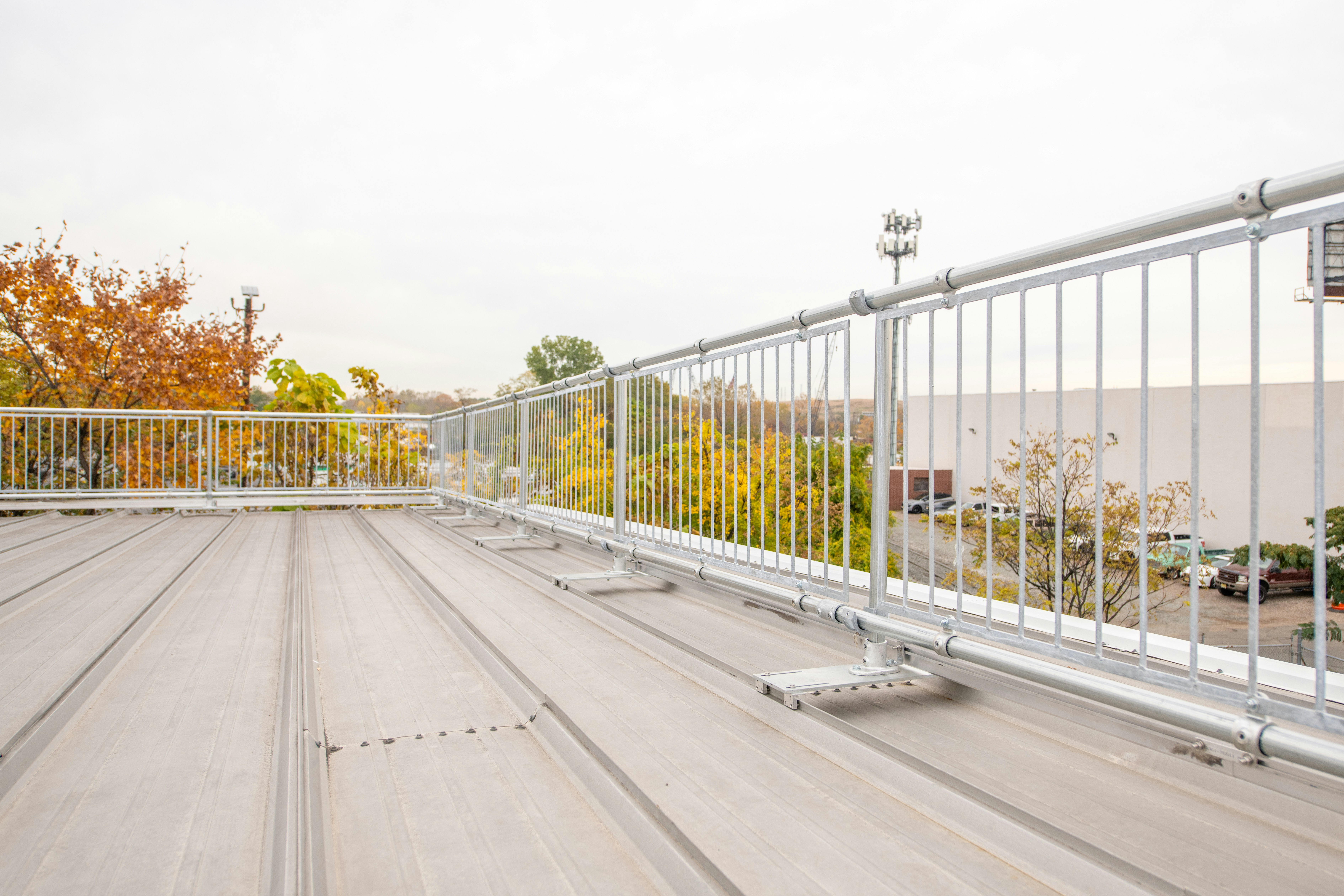 Kee Guard railing protecting a standing seam metal roof.